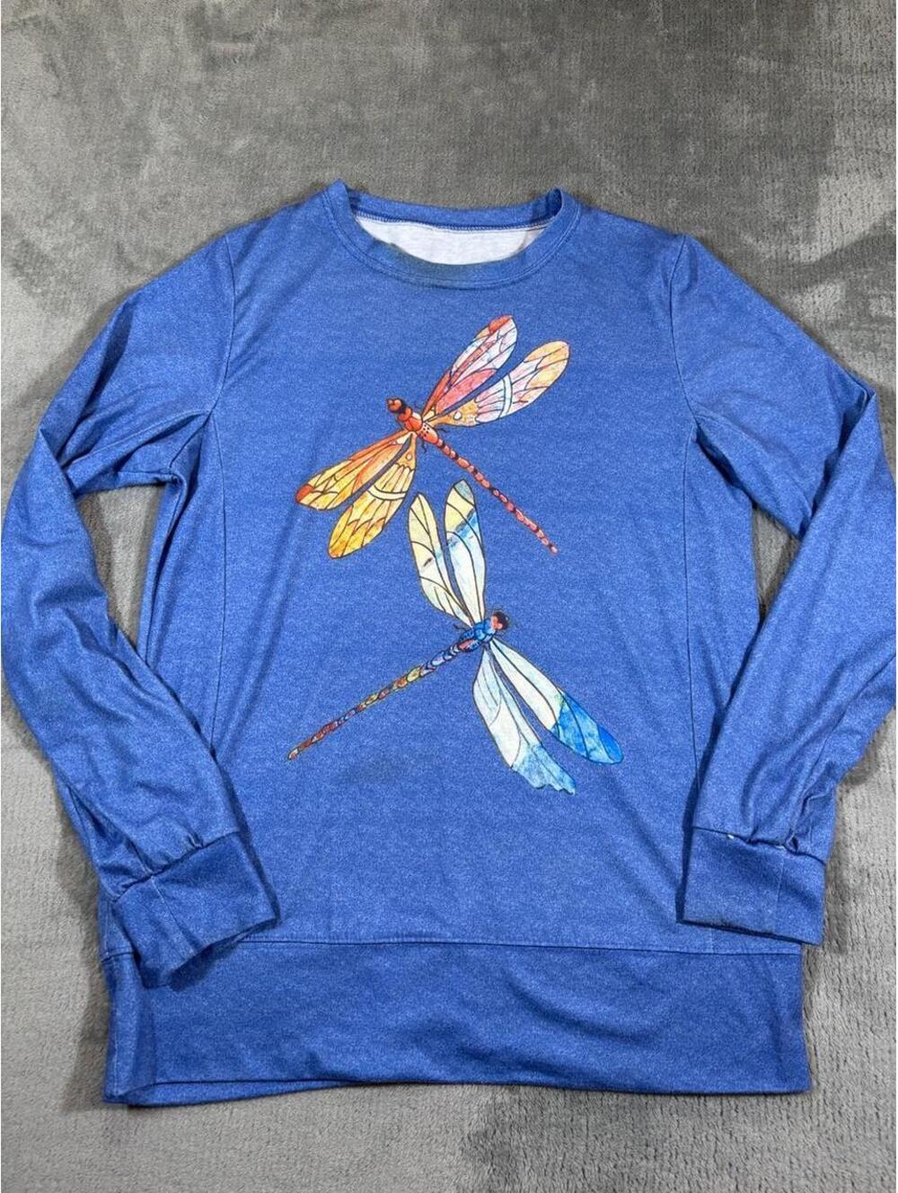 Blue dragonfly long sleeve shirt with two dragonflies in orange, red, and blue